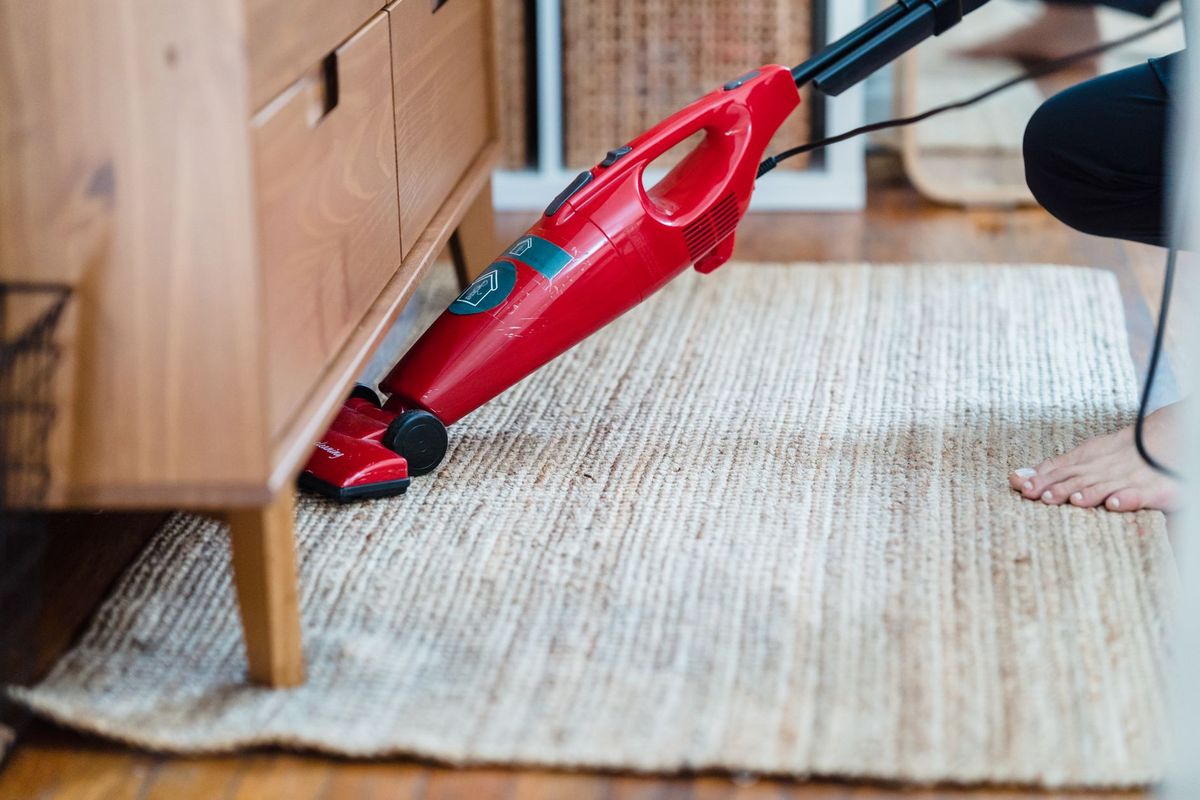 Professional cleaner refreshing a modern Palmer Ranch home